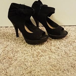 Black ankle zip booties.